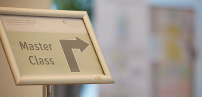 Sign reading "Master Class" with an arrow pointing to the right
