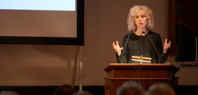 Jennifer Morgan speaking at a lectern
