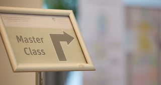 Sign reading "Master Class" with an arrow pointing to the right