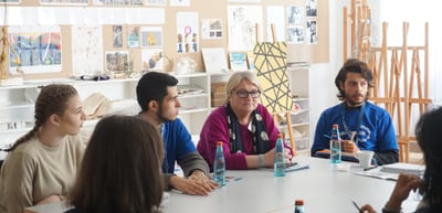 Round table group in an art room with easels