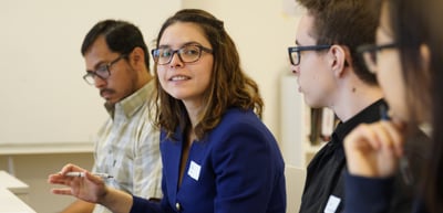Young participants listening in a round table discussion