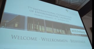 Projection screen showing: 7th International Convention of Environmental Laureates, Freiburg, Germany, 15 - 18 March 2018, #ICELfreiburg, Welcome, Willkommen, Bienvenue