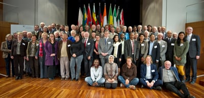 Group photo of the participants of the 2nd convention in front of national flags