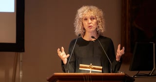 Jennifer Morgan speaking at a lectern