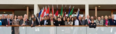 Group photo of the participants of the 2nd International Convention of Environmental Laureates in front of national flags