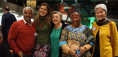 Five participants smiling for a group photo at the Green Dinner