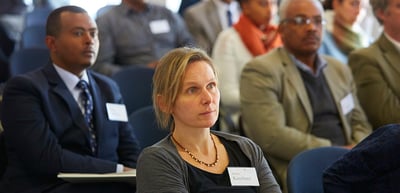 Participants listening attentively in a seminar room