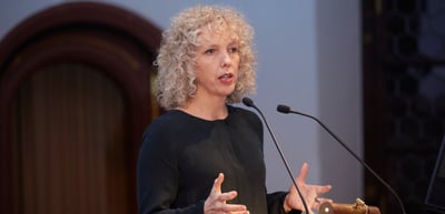 Jennifer Morgan speaking at a lectern
