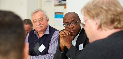 Laureates listening during a round table discussion