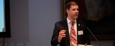 Mathis Wackernagel speaking at a lectern