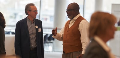 Two men in conversation in the foyer of the Konzerthaus Freiburg