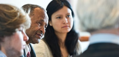 Two participants listening attentively during a conversation
