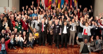 Participants of the 5th ICEL waving in front of national flags