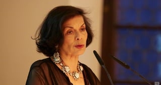 Bianca Jagger speaking at a microphone