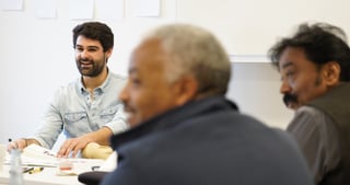 Participants talking at a table during a workshop